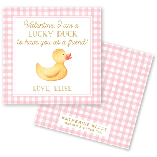 The image is a Valentine's Day card featuring a cute yellow rubber duck on a pink and white checkered background. The card has a message that reads "Valentine, I am a LUCKY DUCK to have you as a friend!" and includes the names "LOVE, ELISE" along with the logo "KATRINE KELLY DESIGN & PAPER CO."