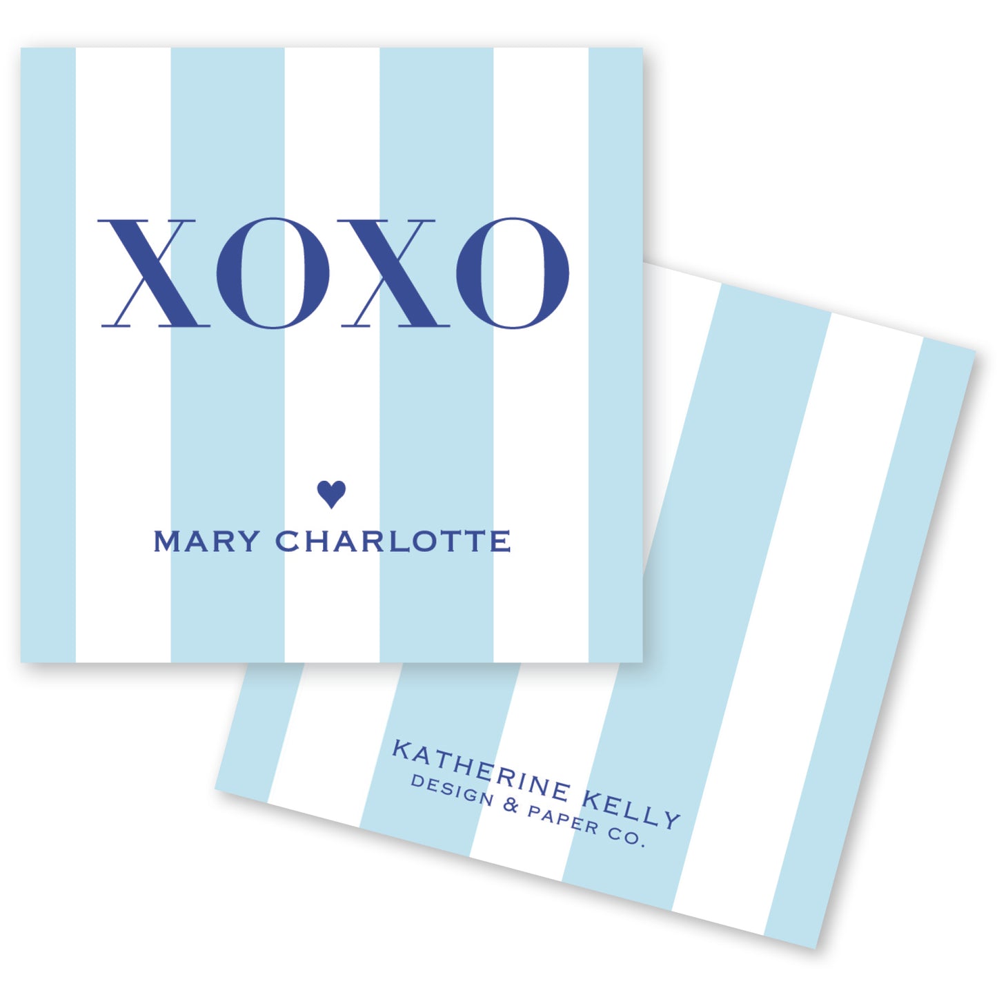 a light blue and white striped card with the word "XOXO" prominently displayed in the center. Below the word "XOXO", the name "Mary Charlotte" is written, and at the bottom, the text "KATHERINE KELLY DESIGN & PAPER CO." is visible.