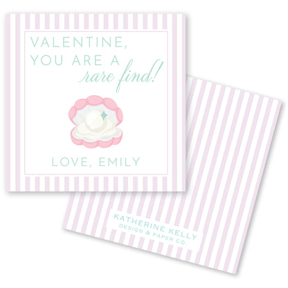 a Valentine's Day card with a pink and white striped background. The card features a message that reads "Valentine, you are a rare find! Love, Emily" along with an illustration of a pearl in an oyster shell. The card also includes the text "KATHERINE KELLY DESIGN & PAPER CO."