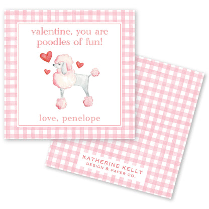 The image is a Valentine's Day card featuring a poodle illustration. The card has a pink and white checkered background and a message that reads "valentine, you are poodles of fun!" The card also includes a name, "love, penelope", and the logo of "KATRINE KELLY DESIGN & PAPER CO."