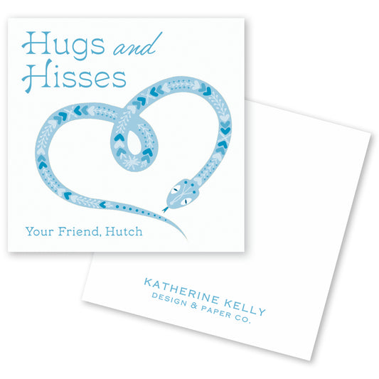 The image is a square card with a blue snake design and the text "Hugs and Hisses" written on it.