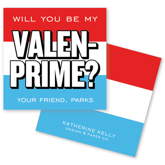 The image is a Valentine's Day card with a bold, red, white, and blue color scheme. The text on the card reads "Will you be my VALEN-PRIME? YOUR FRIEND, PARKS KATHERINE KELLY DESIGN & PAPER CO."