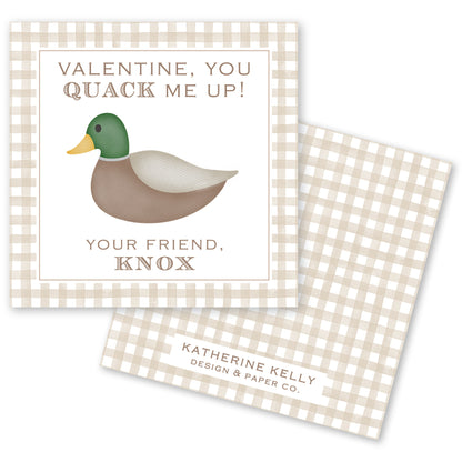 The image is a Valentine's Day card featuring a duck with a green head and brown body. The card has a checkered border and a message that reads "Valentine, you quack me up!" The card also includes a personalized message that says "Your friend, Knox" and the logo of "Katherine Kelly Design & Paper Co."