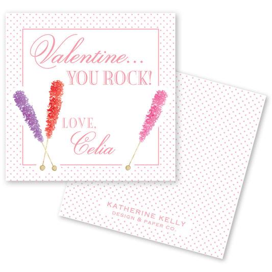The image is a Valentine's Day card with a pink and white color scheme. The card features a message that reads "Valentine... YOU ROCK! LOVE, Celia" along with three colorful candy canes. The card also includes the text "KATHERINE KELLY DESIGN & PAPER CO."