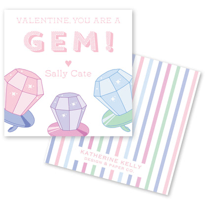 The image is a Valentine's Day card featuring a playful design with three colorful gem-like objects, including a pink gem, a purple gem, and a blue gem, along with the text "Valentine, you are a GEM! Sally Cate" and "KATHERINE KELLY Design & Paper Co."